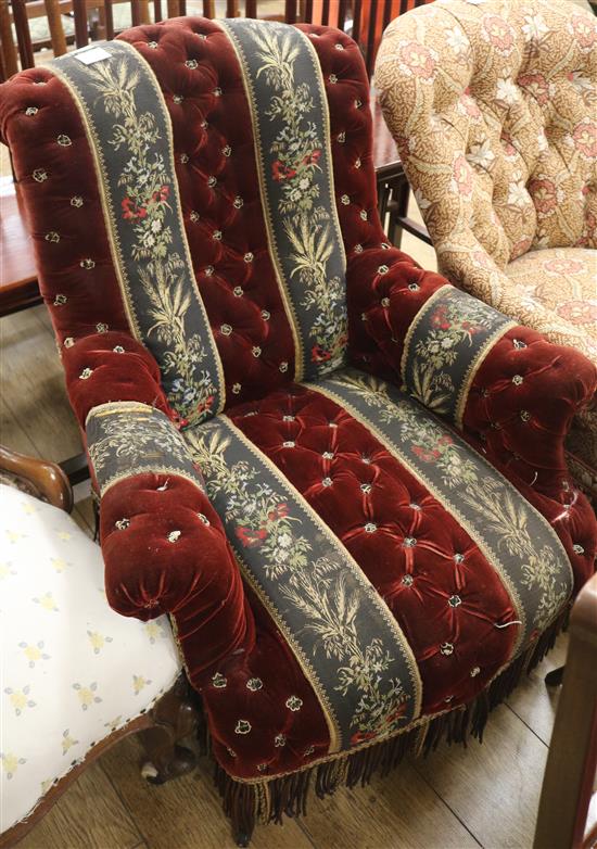 A late Victorian button back ebonised easy armchair
